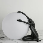 Humanoid Ball Holding Table Lamp Table lamp