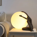 Humanoid Ball Holding Table Lamp Table lamp