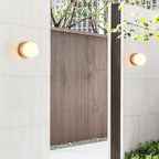 Asteroid Wall Light ∅ 6.3″ x H 6.3″ / Yellow Travertine & White / Warm Light Wall lamp