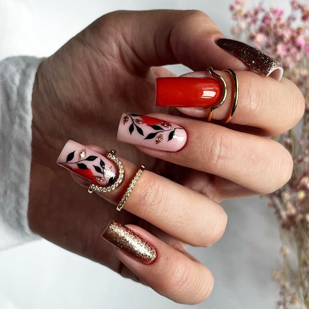 StarNagel Coffin Nails in Rot mit Glitzer und Goldenen Blättern