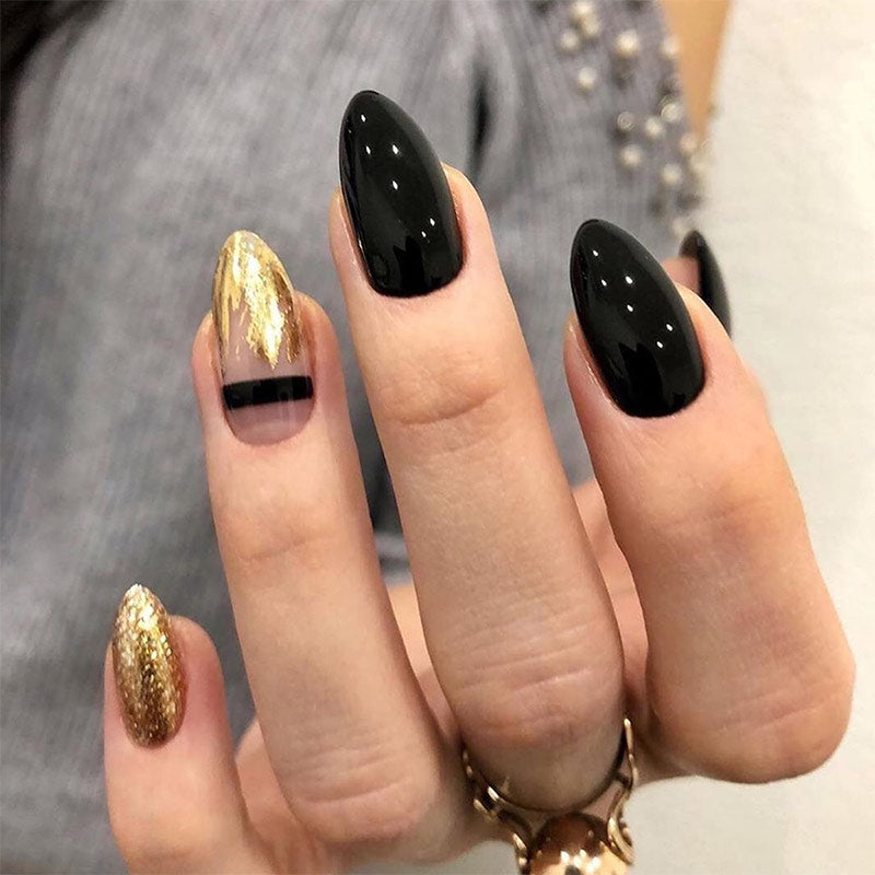 StarNagel Almond Nägel in Schwarz-Gold mit Glitzer und Linienmuster