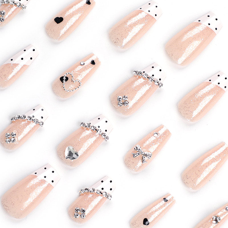 StarNagel Ballerina Nägel in Nude mit Glitzer, Schleifen, Kuhmuster, Punkten und Eisklarem Effekt