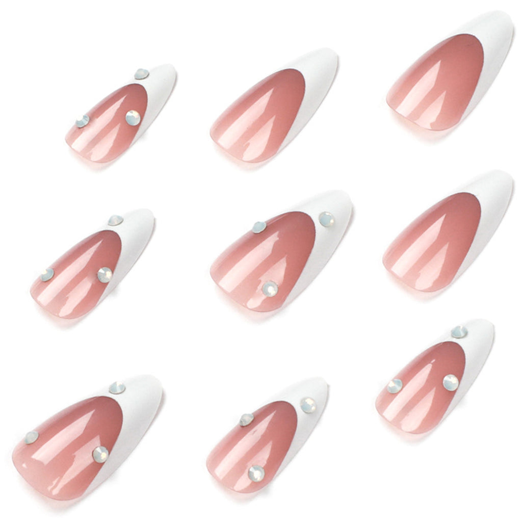 StarNagel Stiletto Nägel im French Look mit weißen Spitzen, nude Farbtönen und Strasssteinen