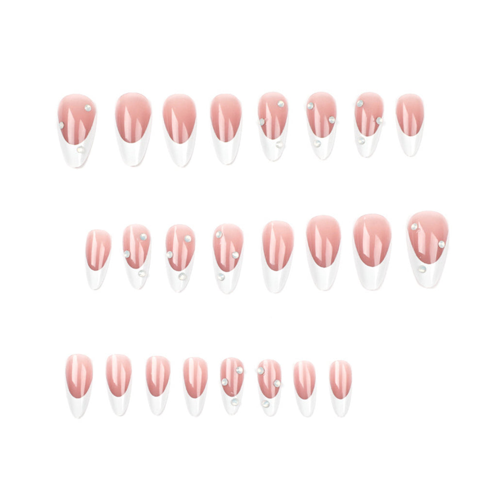 StarNagel Stiletto Nägel im French Look mit weißen Spitzen, nude Farbtönen und Strasssteinen