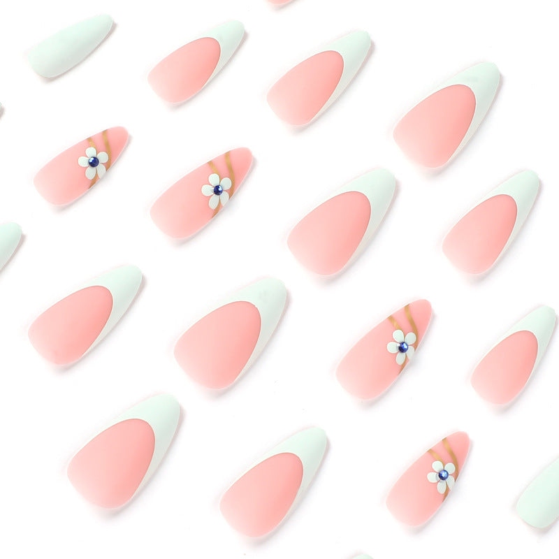 StarNagel Stiletto Nägel in Grünem French mit Mattem Finish, Kleinen Blumen und Blauen Strasssteinen