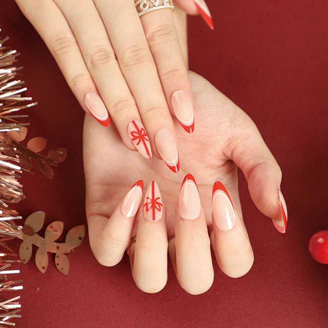 StarNagel Stiletto Nägel Weihnachtsdesign mit Rotem French und Schleifen