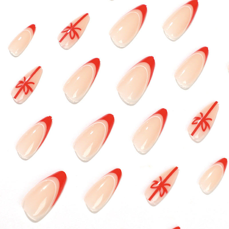 StarNagel Stiletto Nägel Weihnachtsdesign mit Rotem French und Schleifen